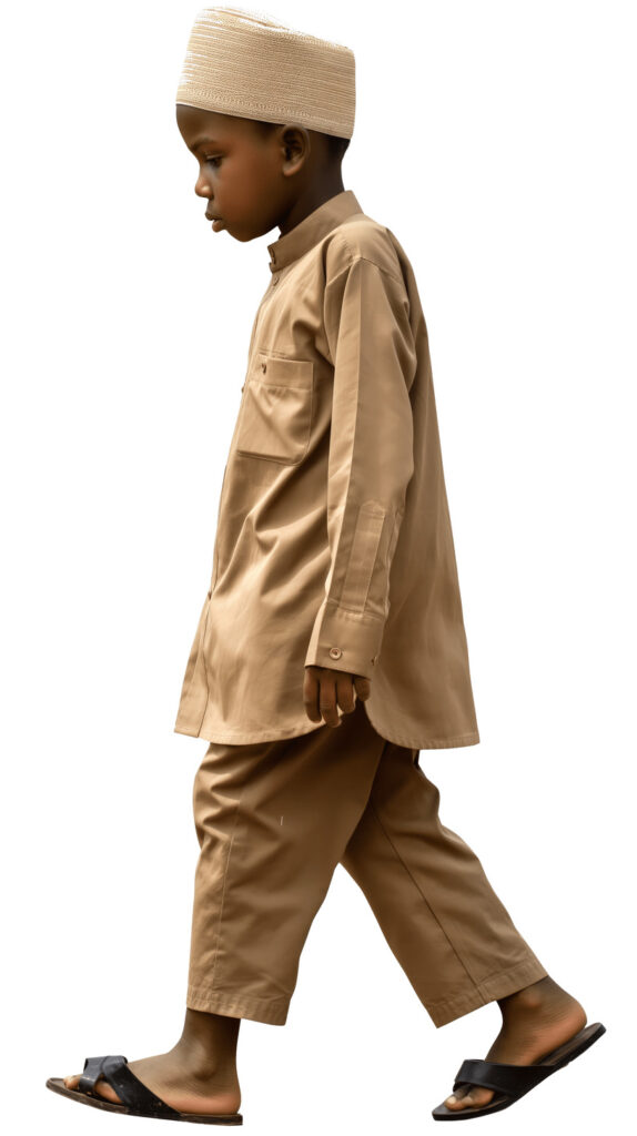 African boy in traditional attire walking