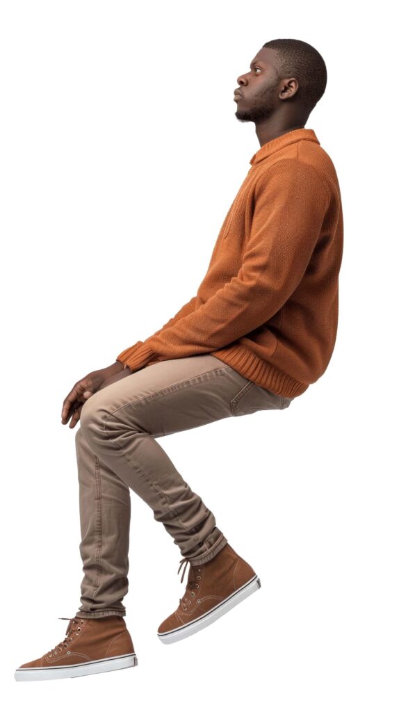 African man in casual attire sitting looking up cutout