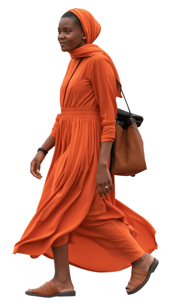 African veiled woman in orange attire walking