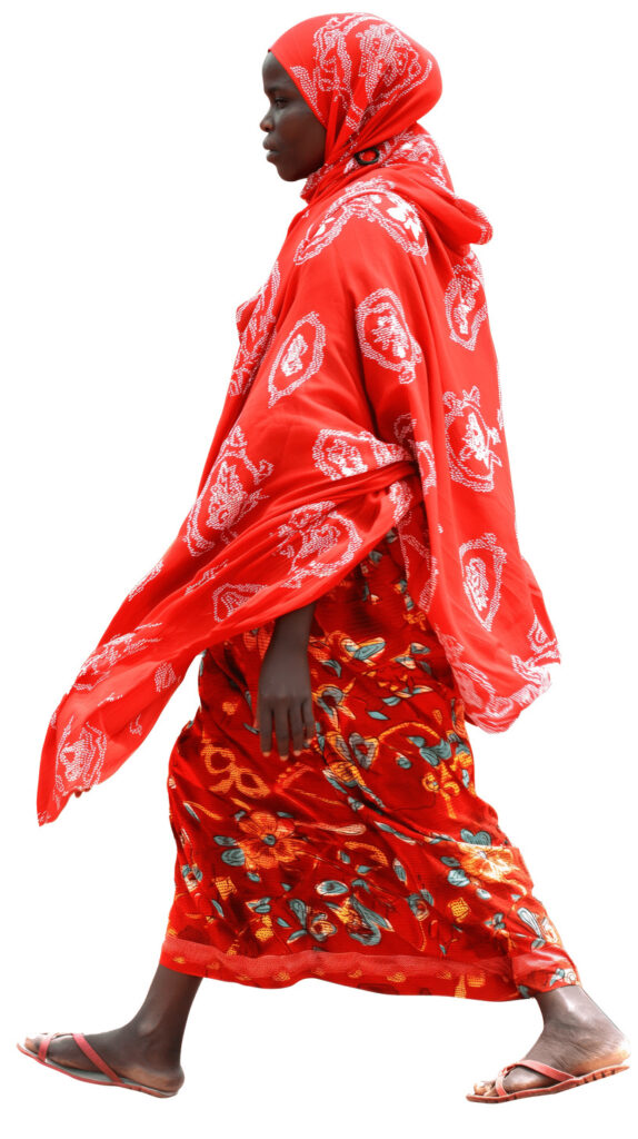 african rural woman walking profile view