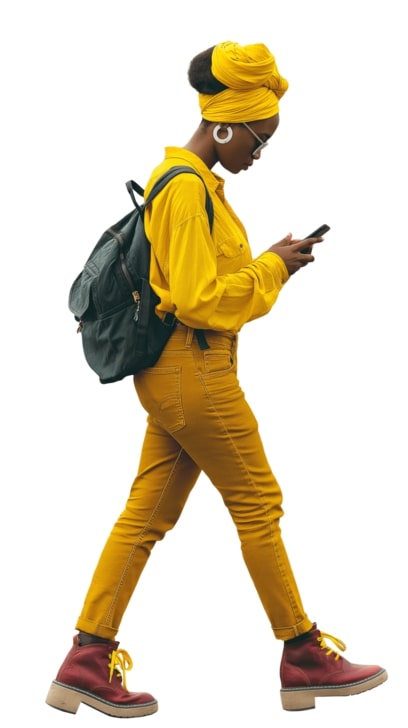 young african woman in modern yellow attire walking while checking on her phone