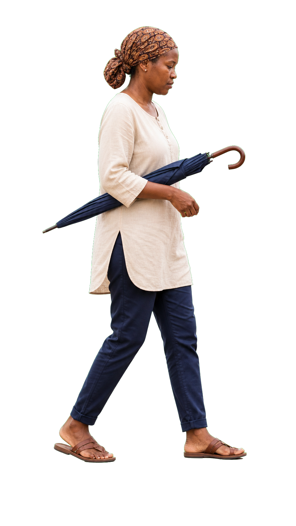 African woman holding closed umbrella under arm