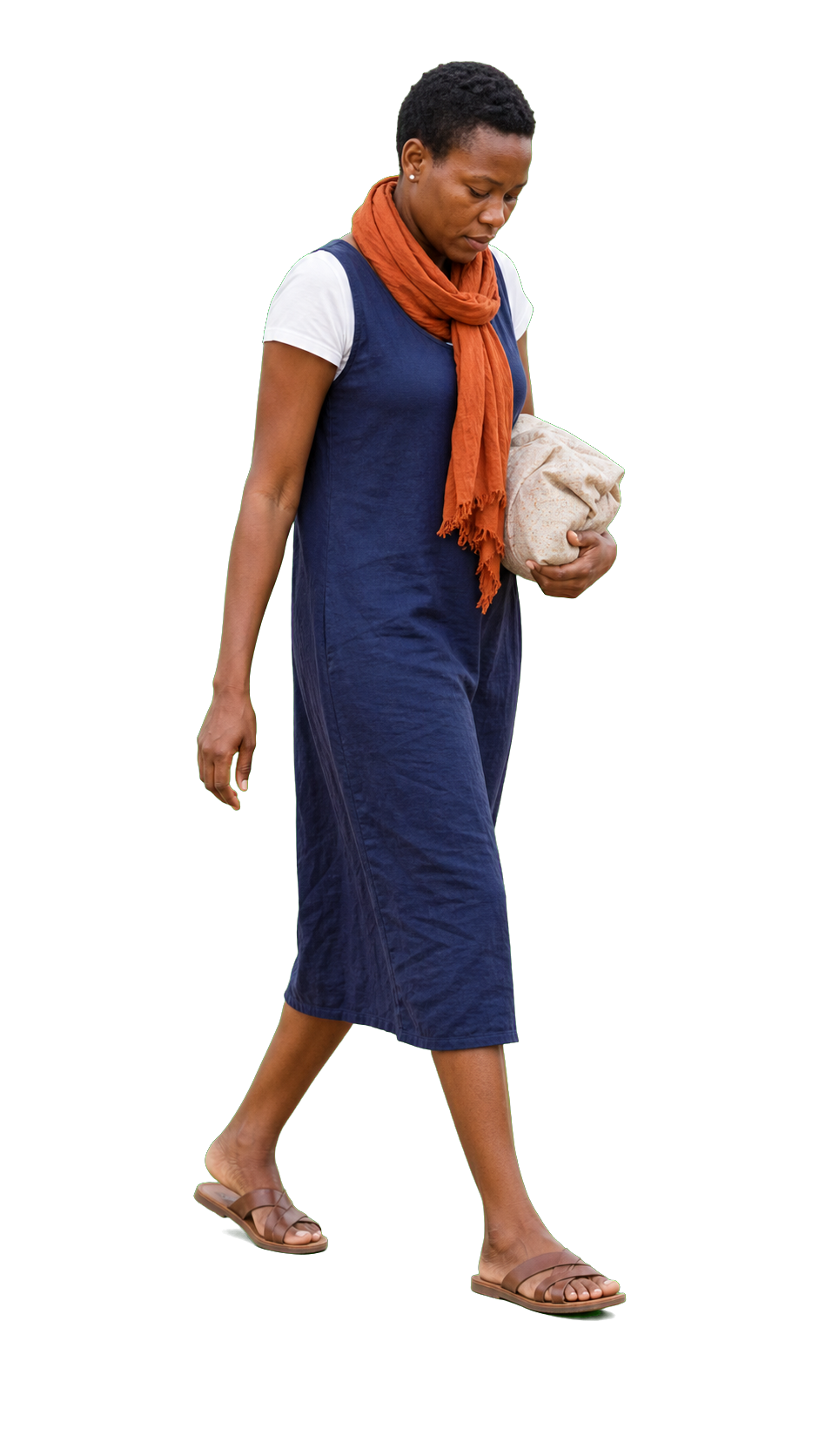 African woman carrying cloth wrapped parcel