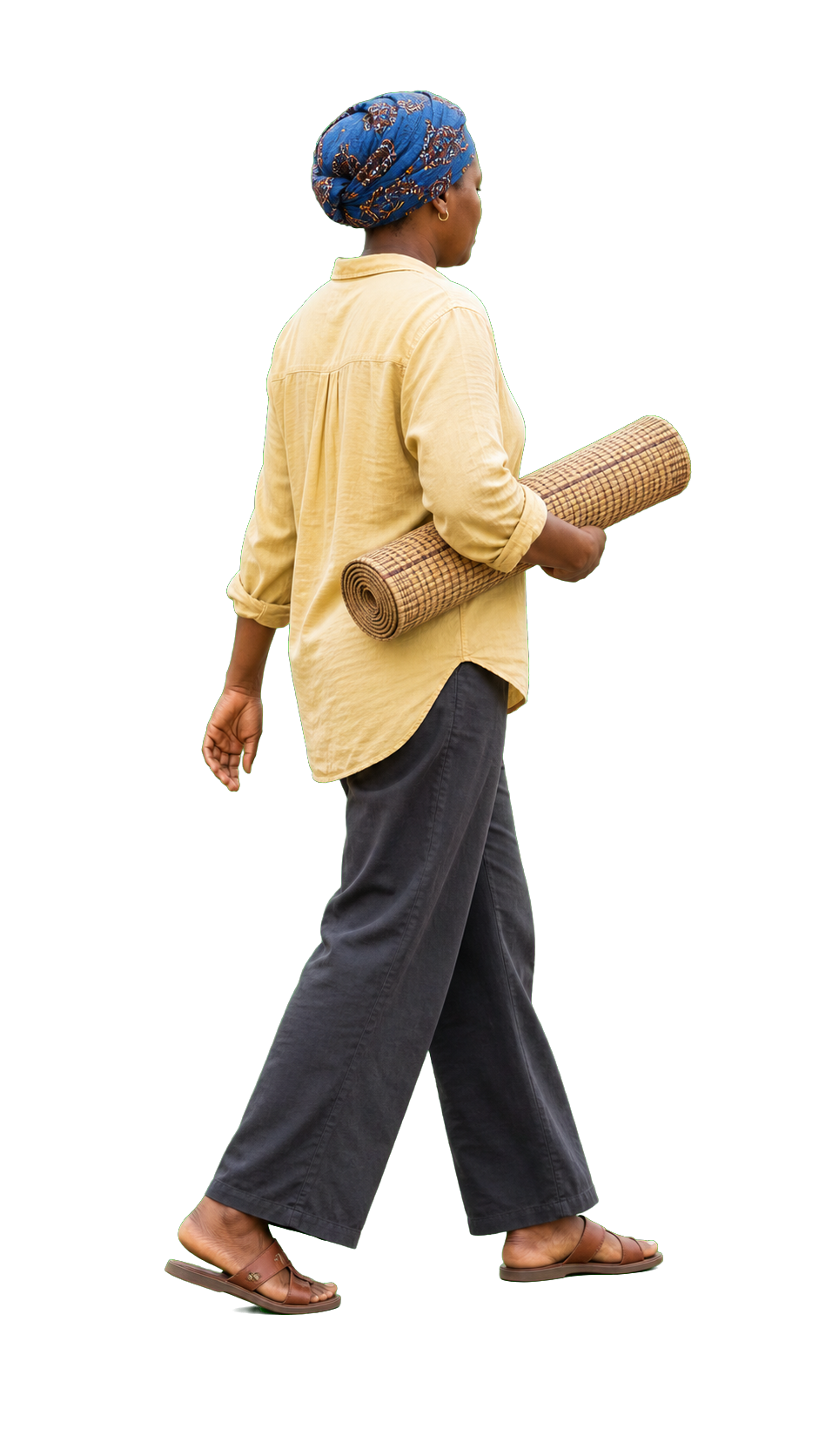 African woman carrying rolled mat under arm