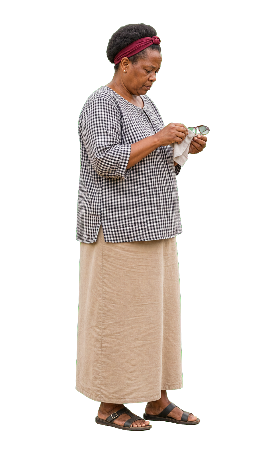 African woman wiping glasses with cloth