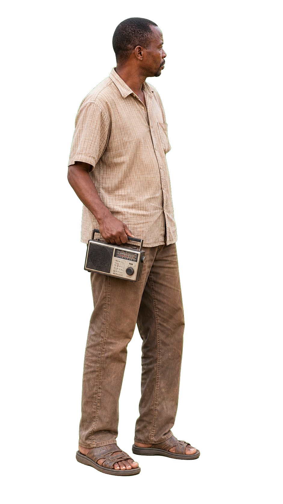 African man holding small radio looking off frame