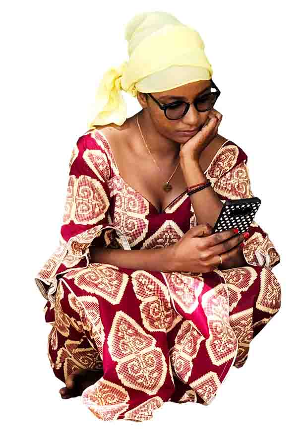 African Woman Sitting Checking her Phone