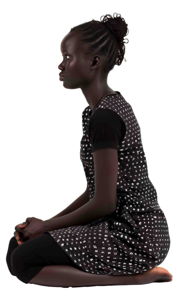 African black girl sitting, profile view
